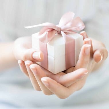 Do you know how to open gifts with grace and poise? Discover how the etiquette of gift giving to help you gracefully accept gifts from others.